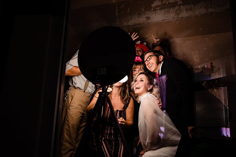 Bride with her best friends inside the photobooth during her reception at Wilburn Street Studio