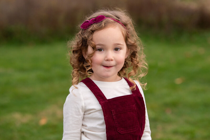 An adorable girl at a park.