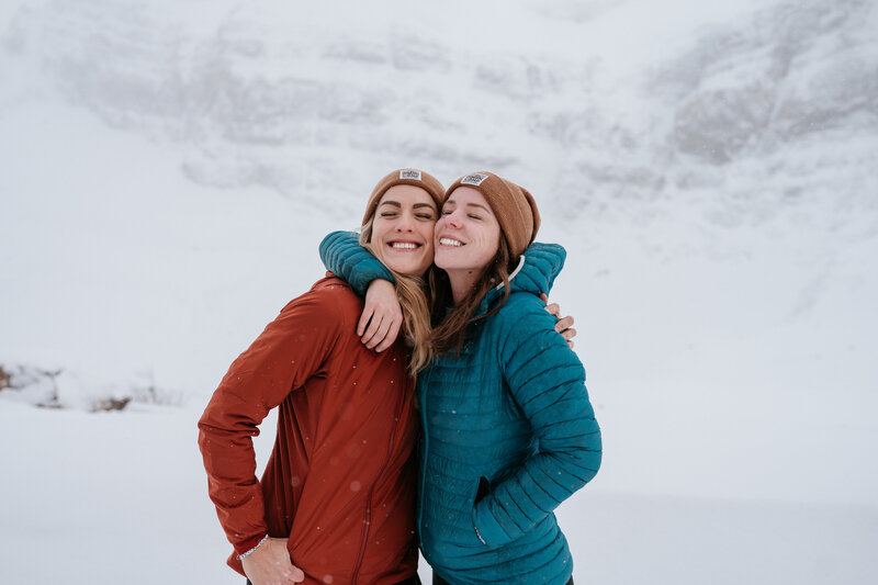 Two elopement photographers at a backcountry hut in Banff National Park