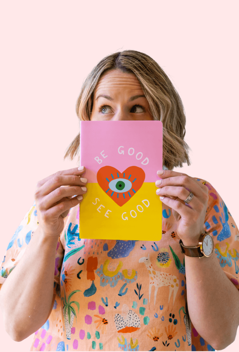 Small Business Branding Resources - Graphic Designer Crystal Oliver holding a fun book