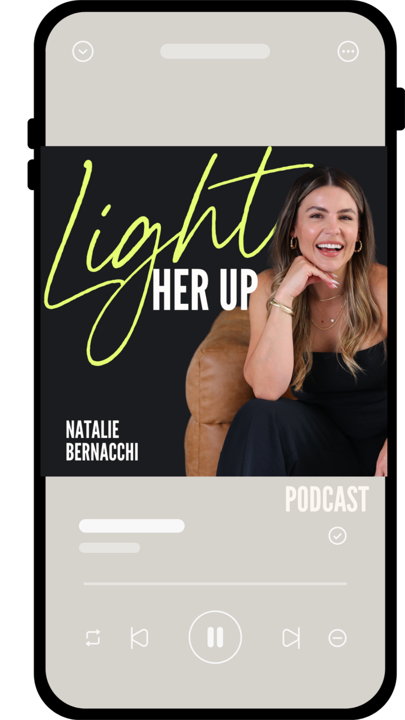 Light Her Up podcast by Natalie Bernacchi displayed on a smartphone screen, featuring a woman in a hat with a serene background and bold text overlay.