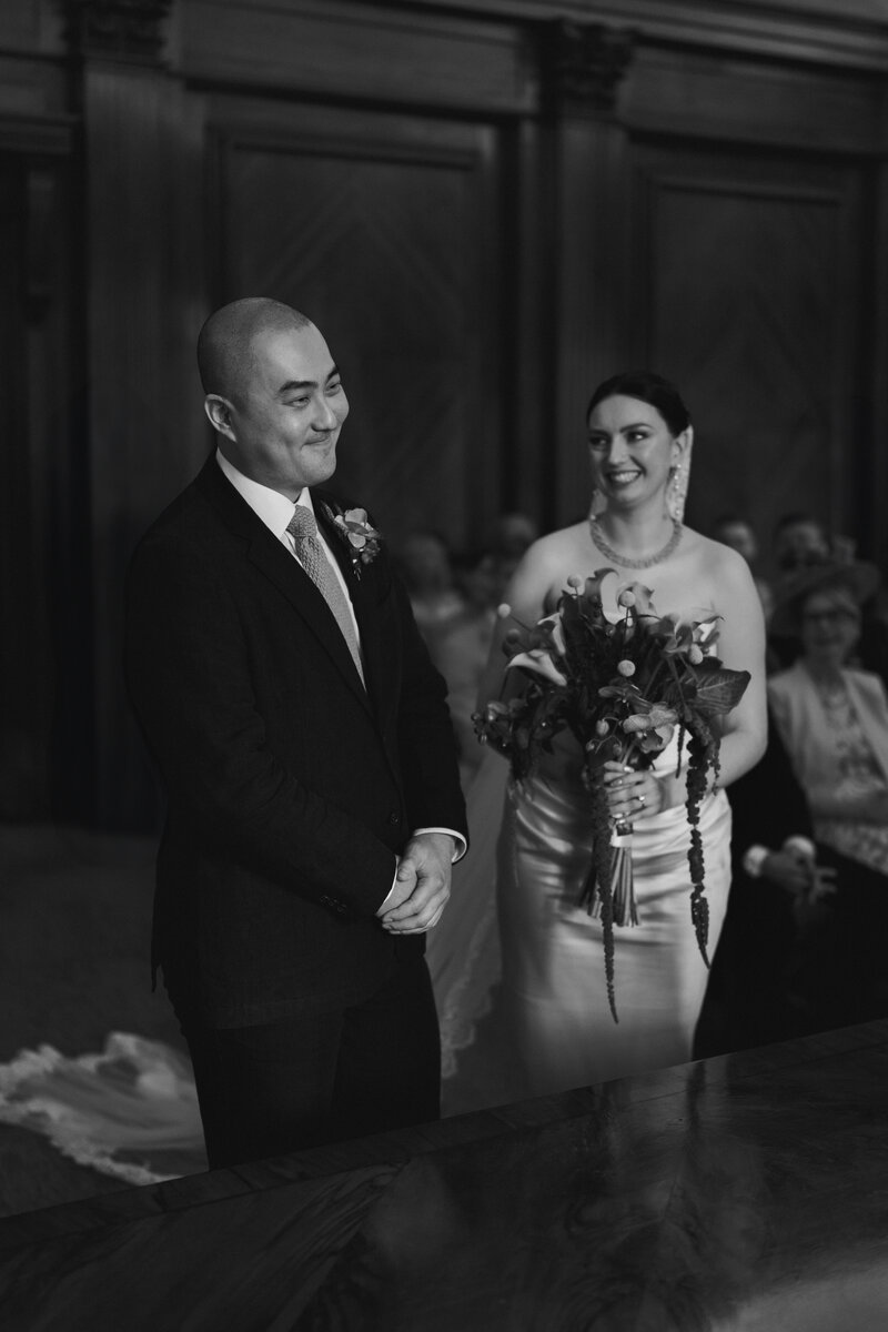 Wedding photographer captures couple taking a stroll hand in hand at their french chateau wedding.