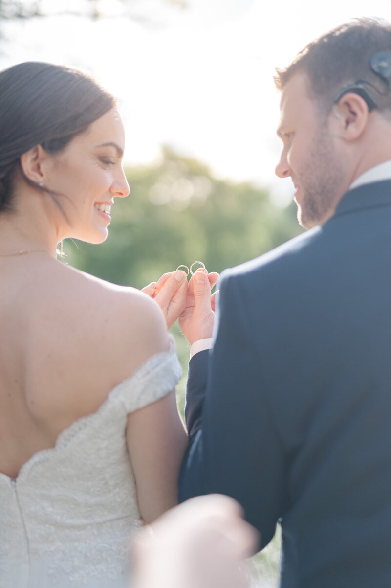Lovers holding together their wedding rings in Laurentides, Quebec
