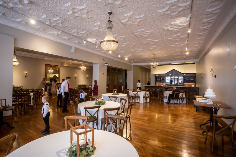 View Of Wedding Reception, Historic Bar, Tables And Chairs