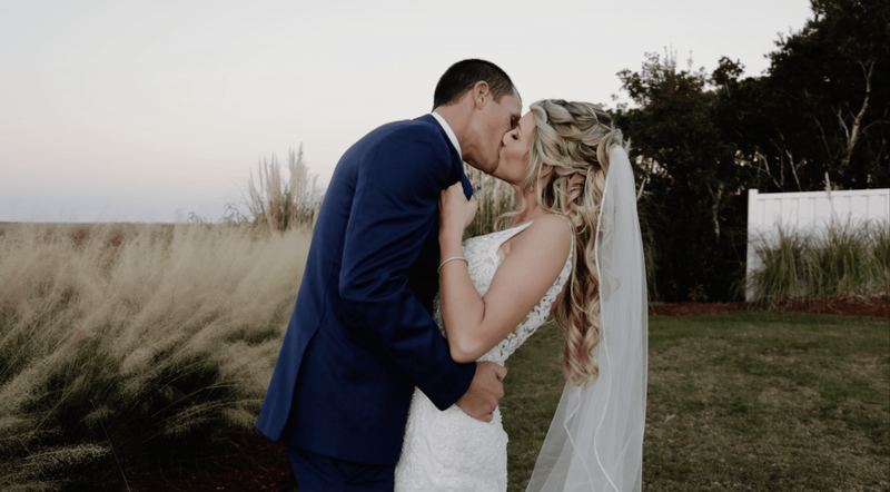 Bride and groom stand together on wedding