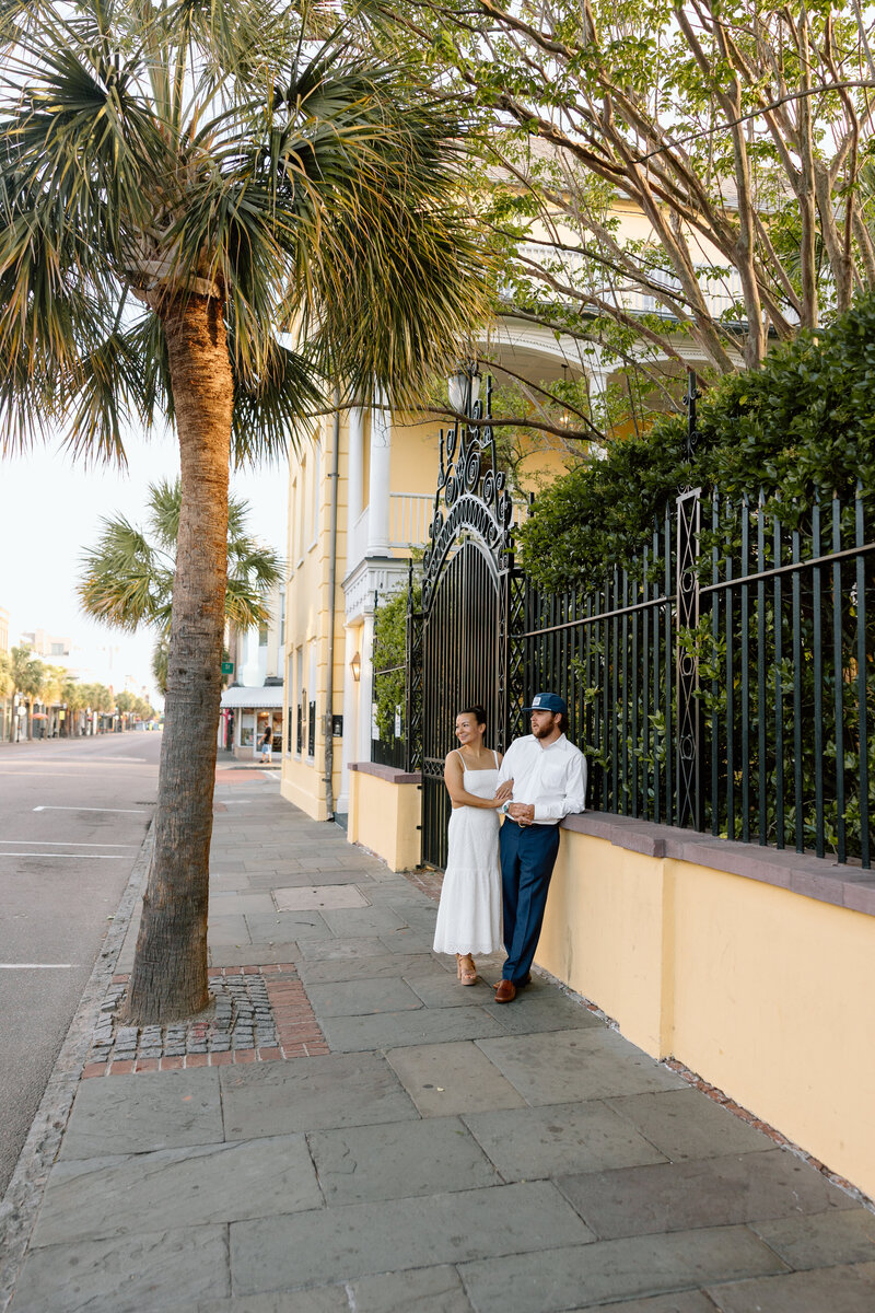 Couple walking along King Street in downtown Charleston.