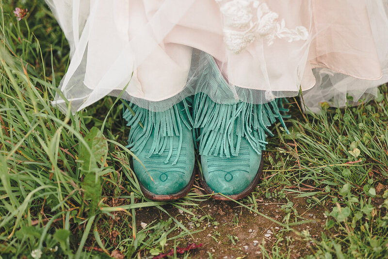 bride wears cowboy boots for her elopement in Vermont