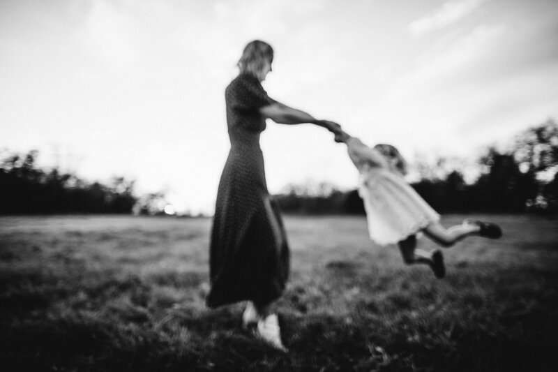 mom with kid in a lake