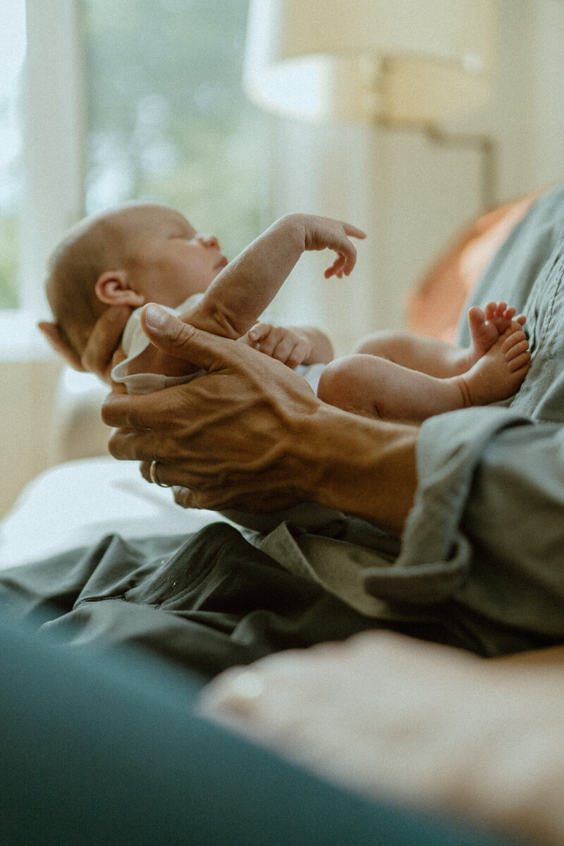 father holding newborn