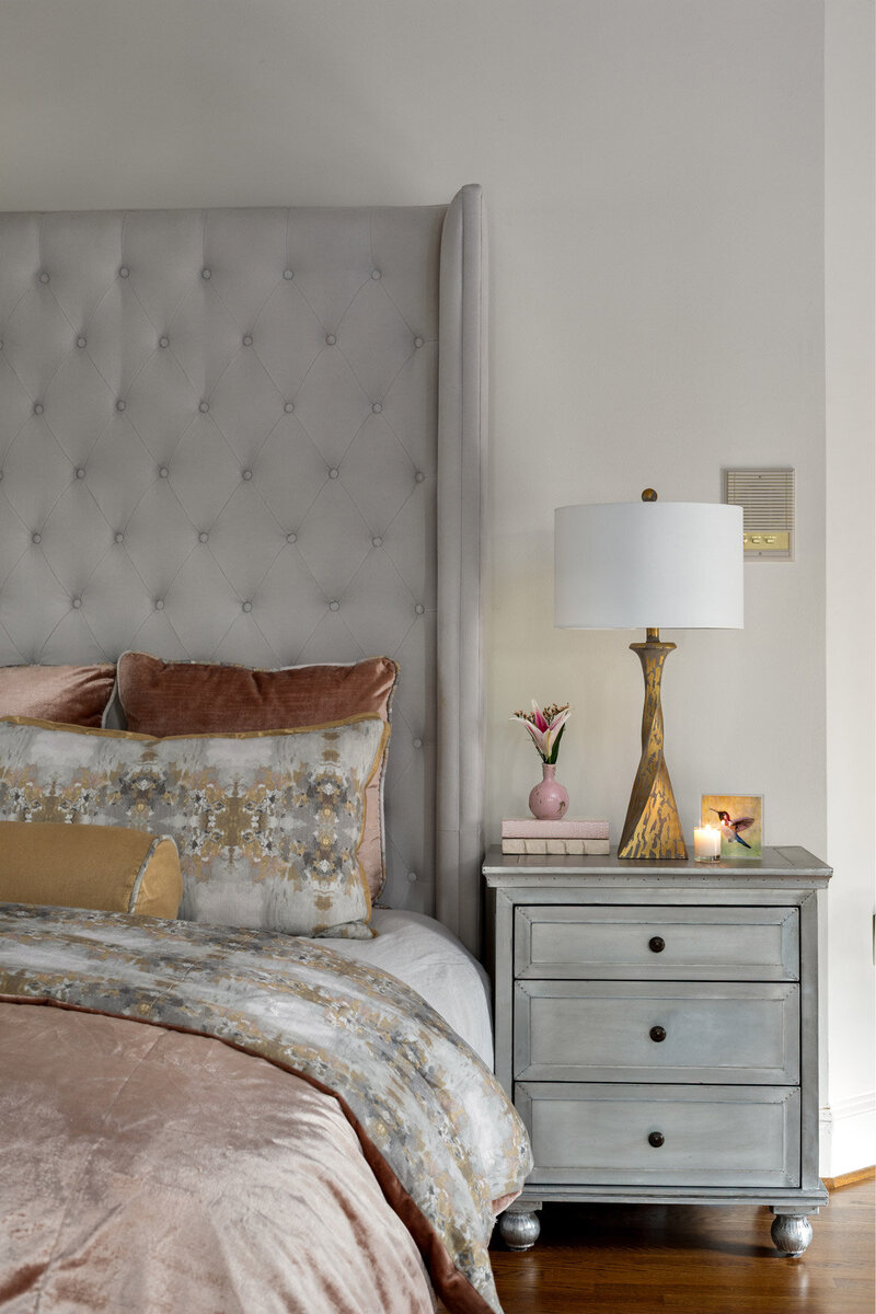 Luxurious textiles and bedding in a primary bedroom.