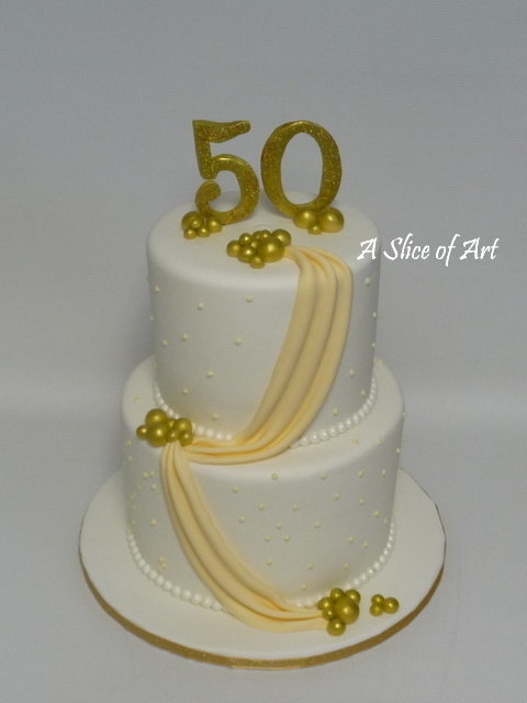 gold swag 50th anniversary cake