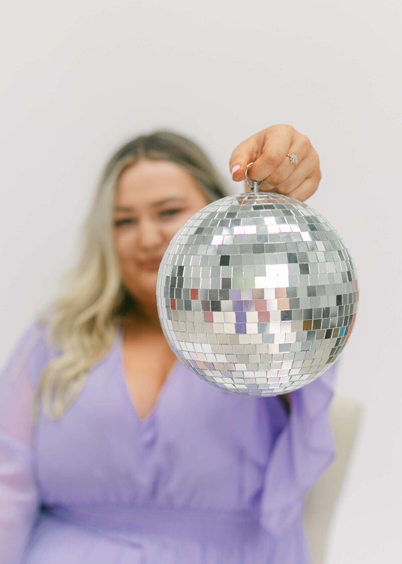 Disco ball covering face close up