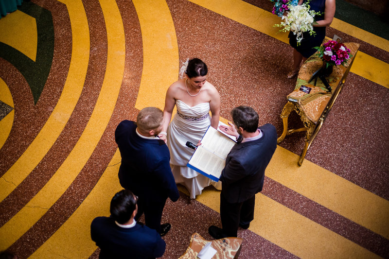 Warner Theatre wedding ceremony as seen from the top of the Grand Staircase