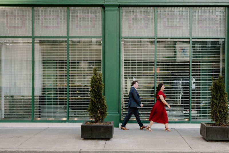 A couple walking in line together on a sidewalk