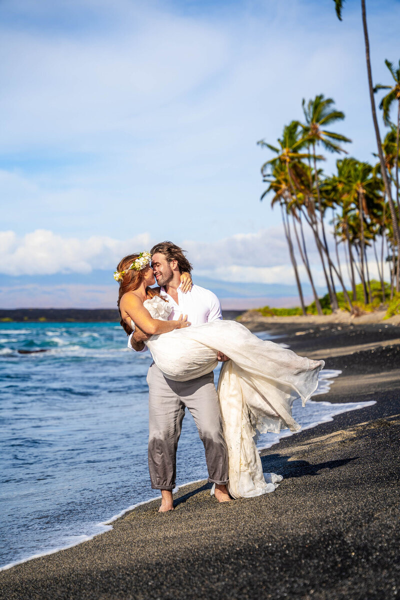 Couple wedding photos on black sand beach, taken by one of the best Big Island photographers