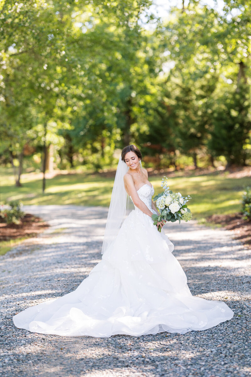 Bride posing outside of Southern Grace Farms. Southern Grace Farms is a wedding and event venue located in Angier, North Carolina, just minutes from Raleigh.