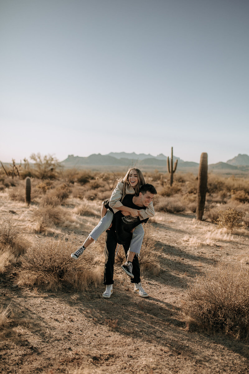 piggyback ride engagement session pose in phoenix