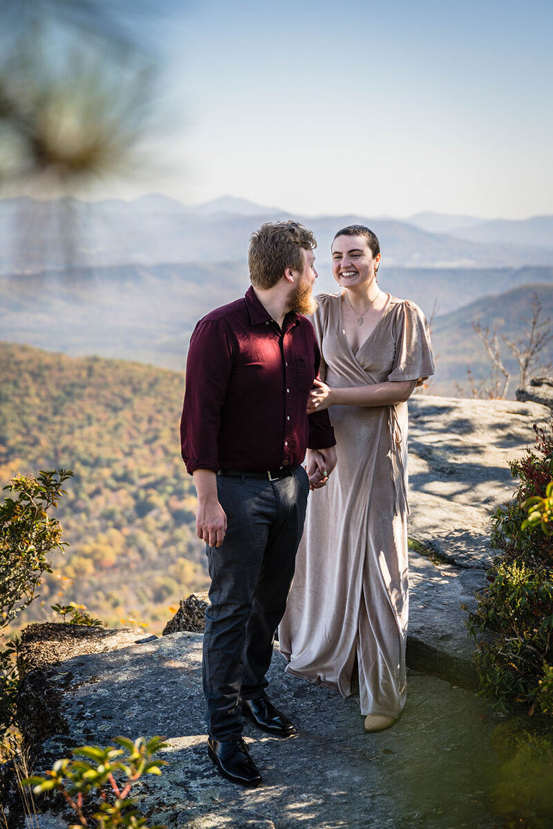 A bride and groom walk hand-in-hand in the empty streets of Downtown Roanoke on their elopement day in Virginia.