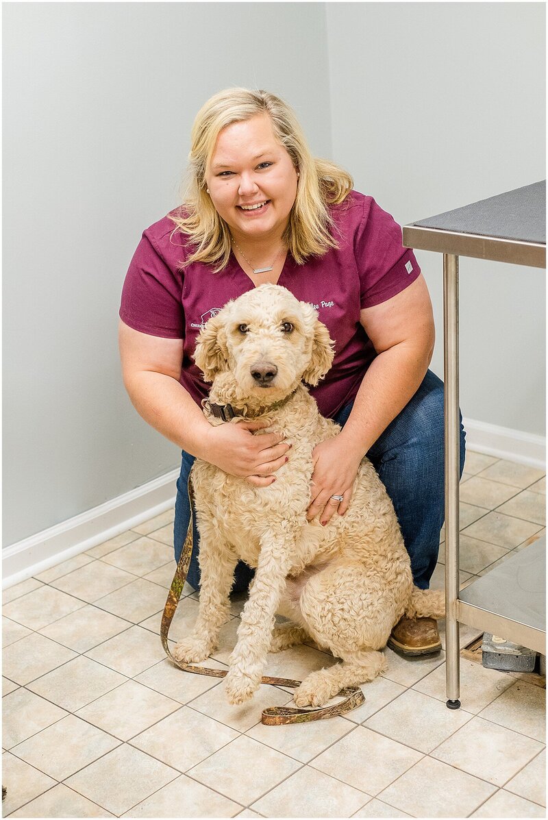 veterinarian posing with her dog