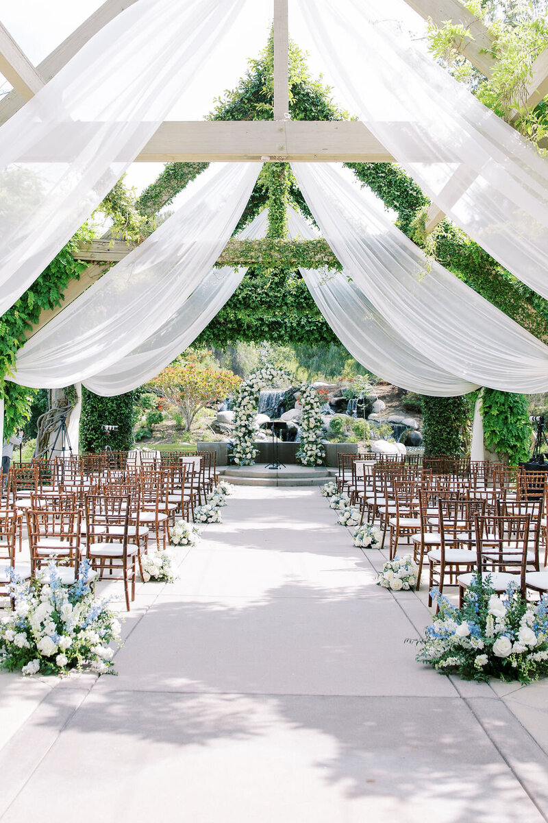 2-radiant-love-event-outdoor-ceremony-high-flowy-white-romantic-drapes-greenery-romantic-elegant-timeless-