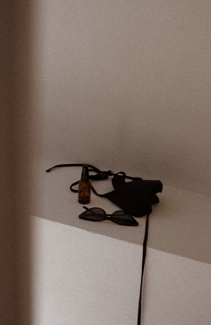 Photograph of stationary on a table in sunlight and beige shades