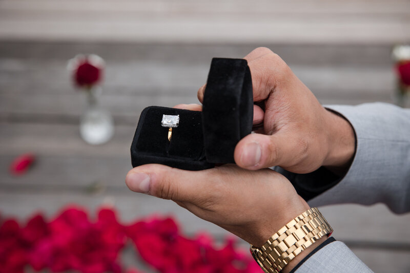 close-up-of-indian-man-holding-diamond-ring-in-box
