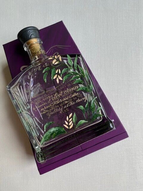 Flor de Caña x rum bottle painted and engraved