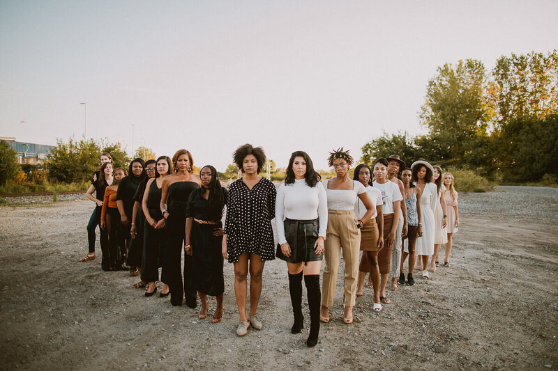 Diverse group of women standing together in unity, symbolizing collective empowerment and leadership.