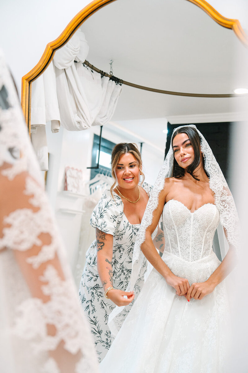 three brides trying on a dress
