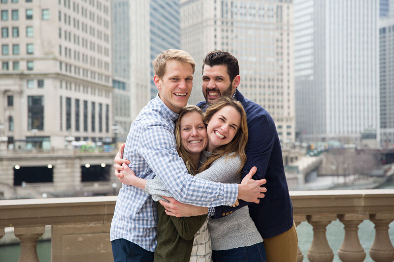 friends celebrating engagement proposal in downtown chicago