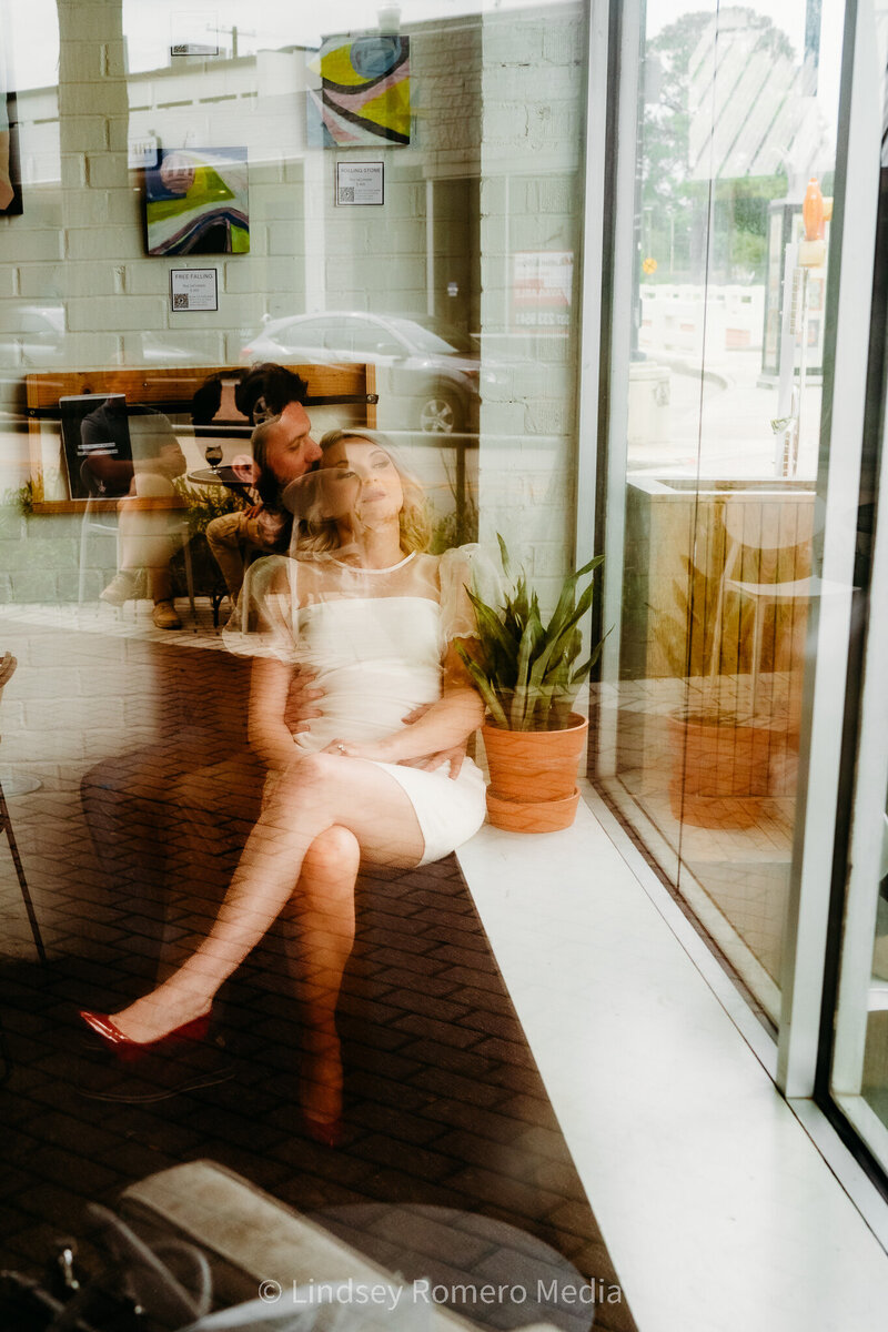 romantic elopement pose in coffee shop in downtown Lafayette, Louisiana