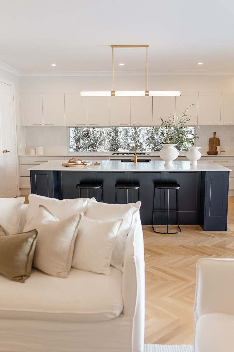 White kitchen with navy island