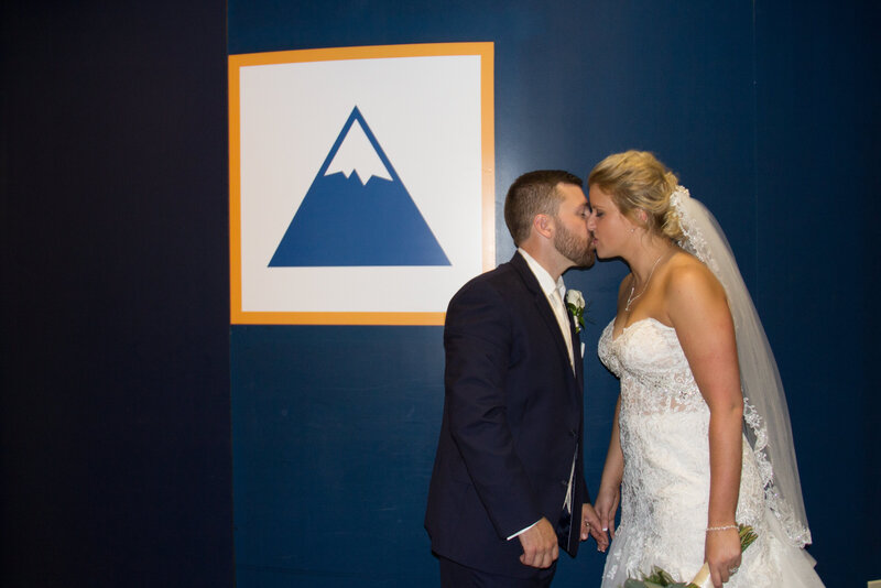 Bride and Groom standing in front of Mountain painting | Sugarloaf Wedding Photography