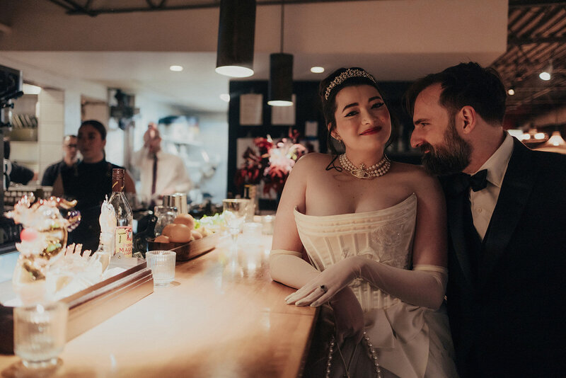 Friends and family enjoying dinner during wedding reception at Mott Street restaurant in Chicago, photographed by Bradi Potter