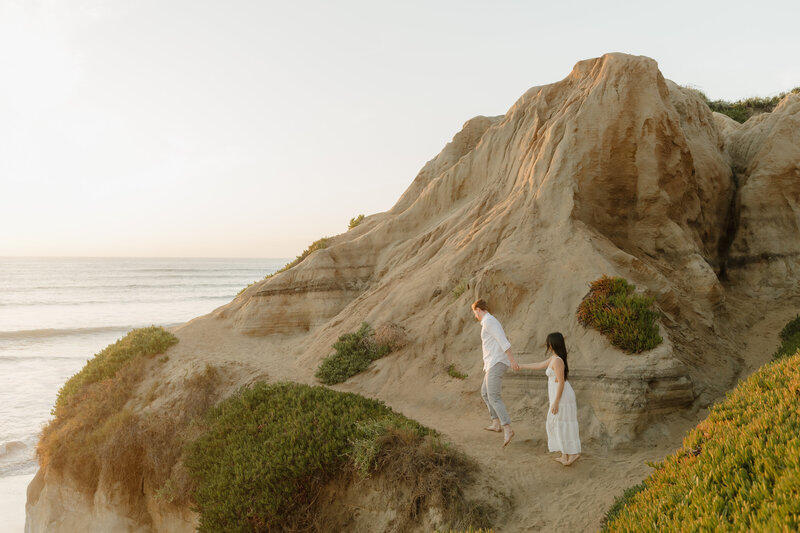 A golden hour engagement photo at Blacks Beach