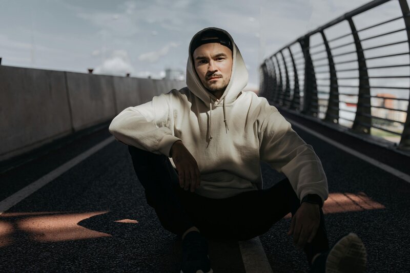 Image of personal fitness trainer sitting on road