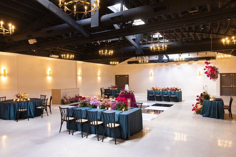wide shot of Locus as reception space, showing in-house black and white dance floor and lighting elements