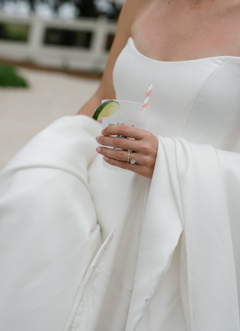 Bride holding drink, taken by Shelby Ann Photos, jacksonville wedding photographer