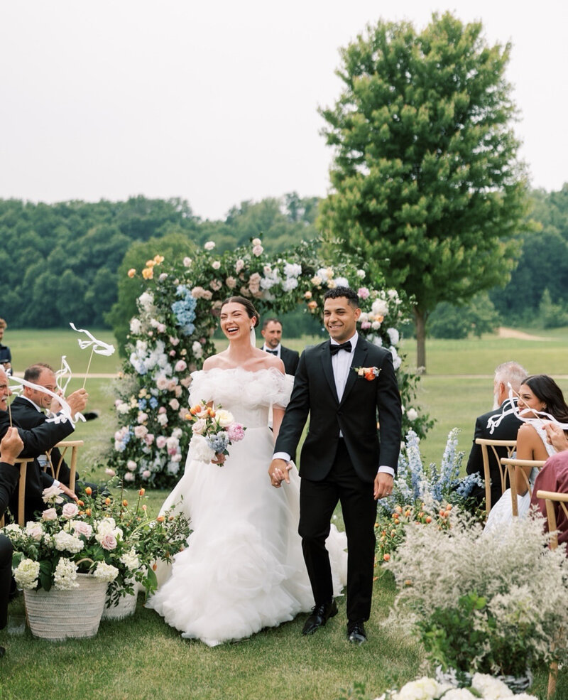 bride and groom walking in museum