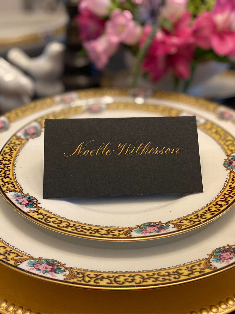 Elegant place card of guest's name for her spot