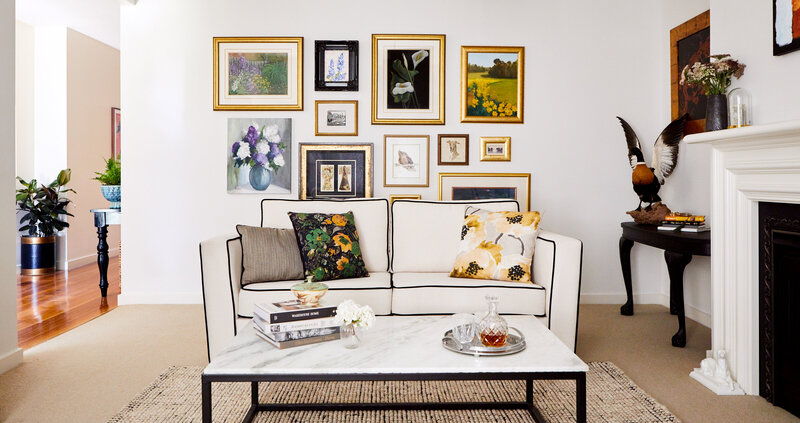 Classic living room mixing heritage details and contemporary style by interior decorator service.