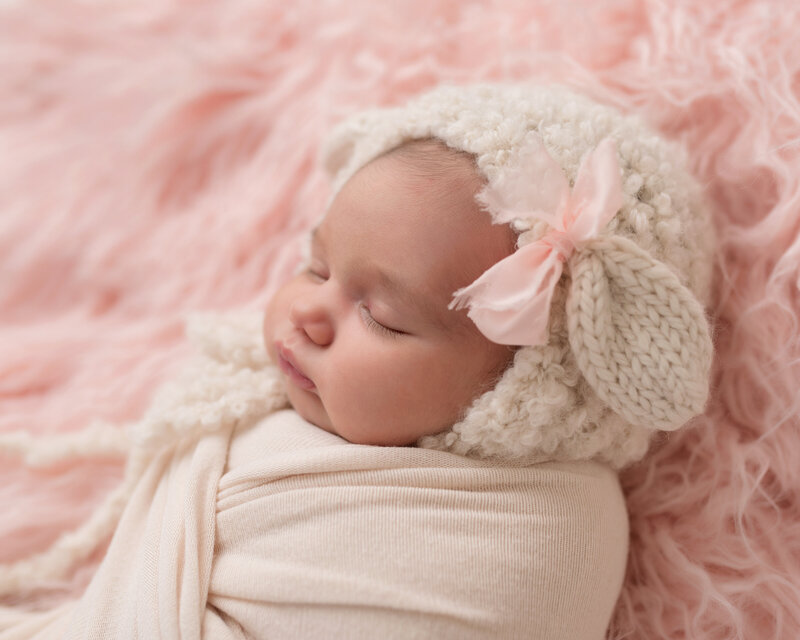 Sleeping Baby in pink fur photography