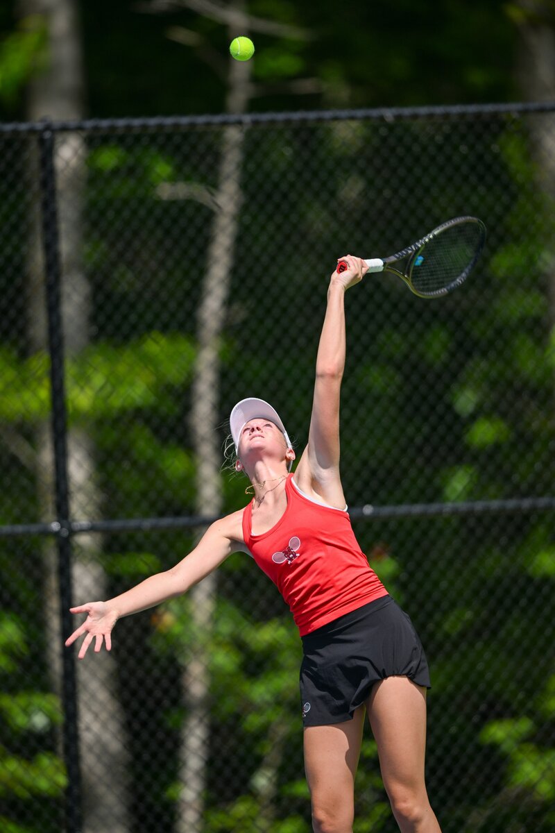 Senior Tennis Player Serving