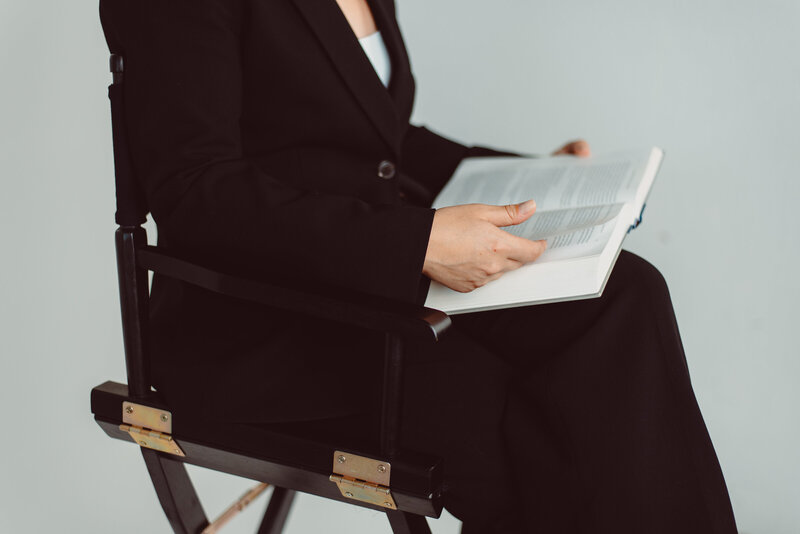 California appellate lawyer in chair reading a book