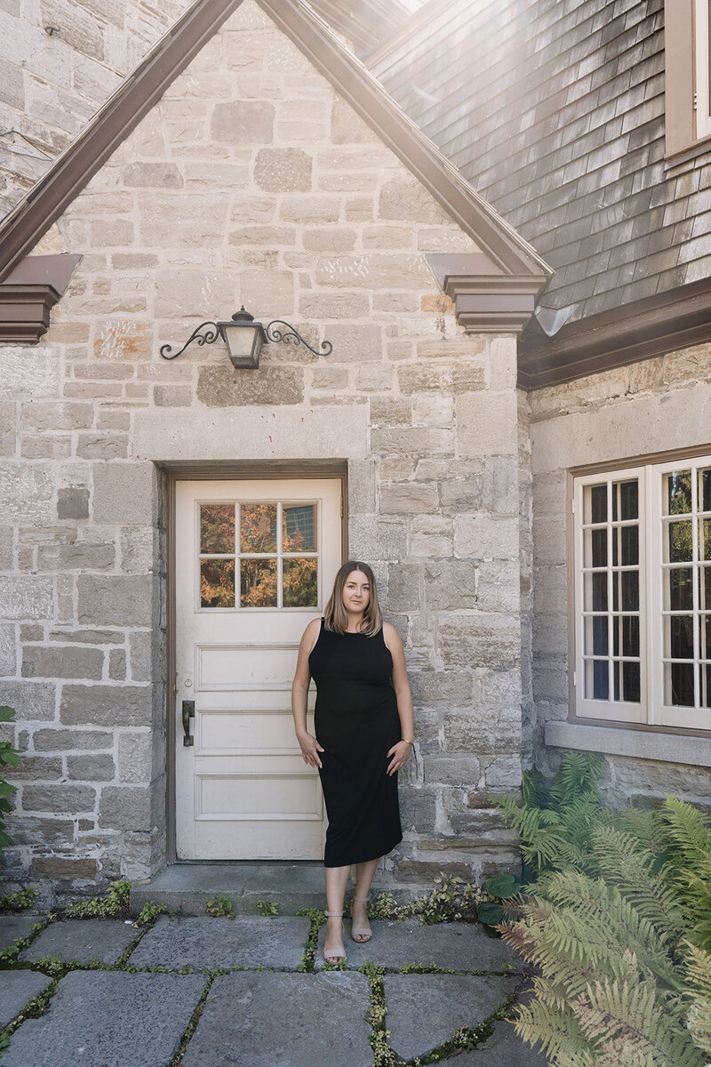 Danielle Aisling walking through a sunlit garden — Ottawa-based destination wedding photographer capturing cinematic, soulful imagery.
