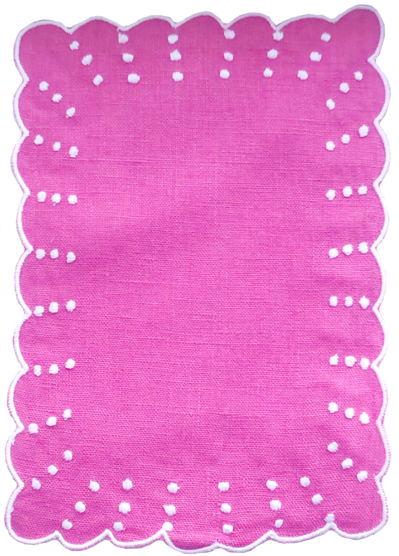 Scalloped edge hot pink placemat with white embroidered  border and swiss dots
