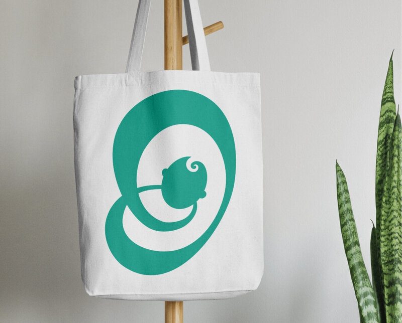 Custom abstract green baby logo design by Helia Studios
