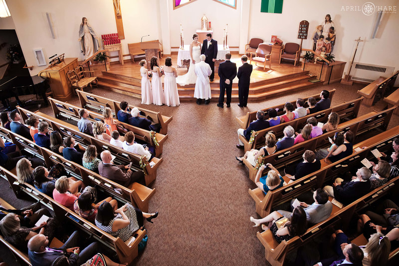 View of a wedding from the balcony looking down inside of St. Mary's Catholic Church