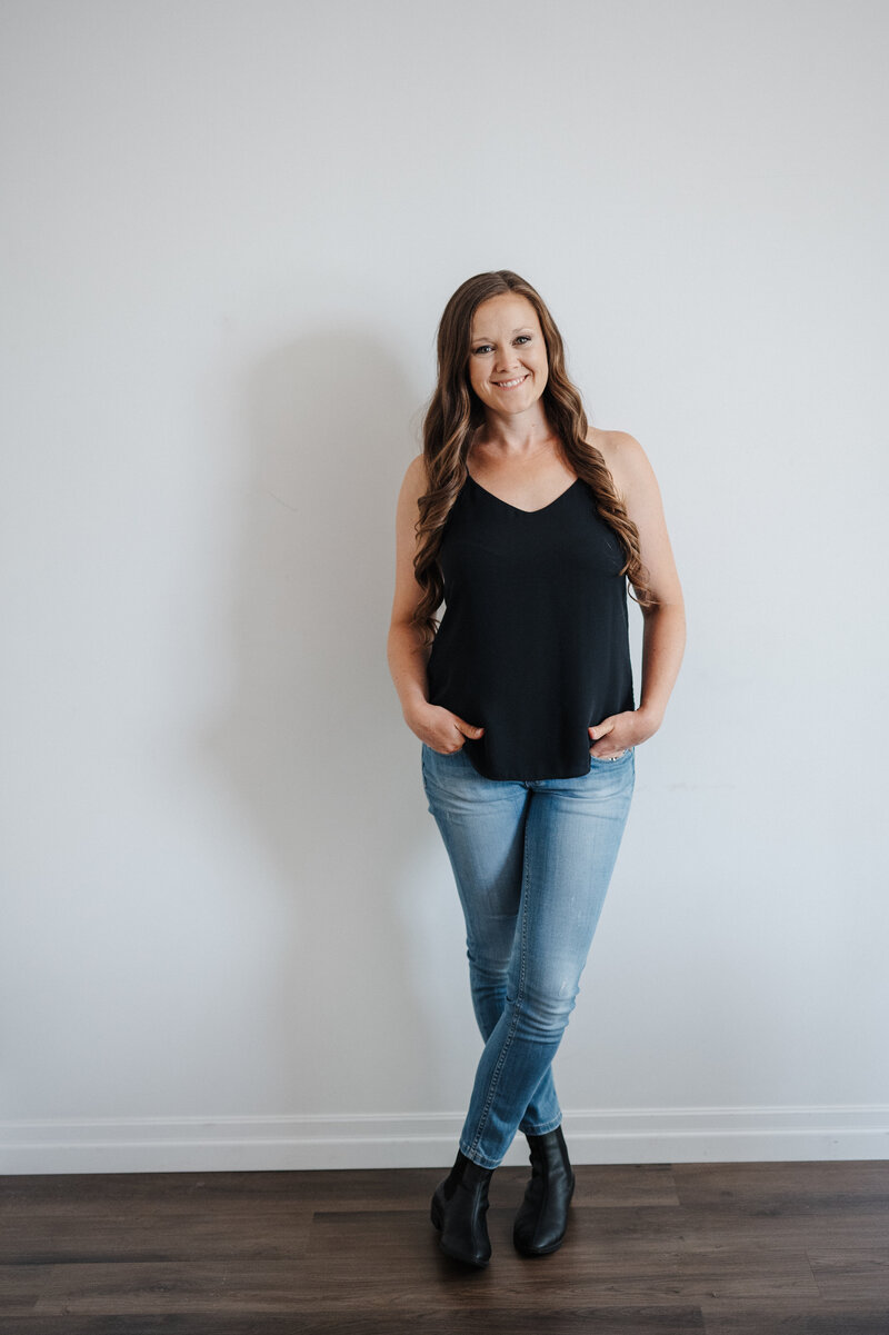 woman in jeans and  a black shirt