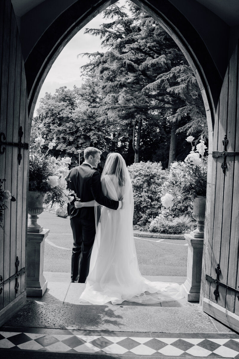 couple-at-church-door-summer-wedding